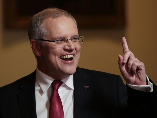 CANBERRA, AUSTRALIA - MAY 09:  Treasurer Scott Morrison speaks with comedian Peter Helliar in the budget lockup at Parliament House on May 9, 2017 in Canberra, Australia. The treasurer will identify key areas including using pre-income tax to assist first home buyers, details on the Western Sydney Airport and funding to assist with schools.  (Photo by Stefan Postles/Getty Images)