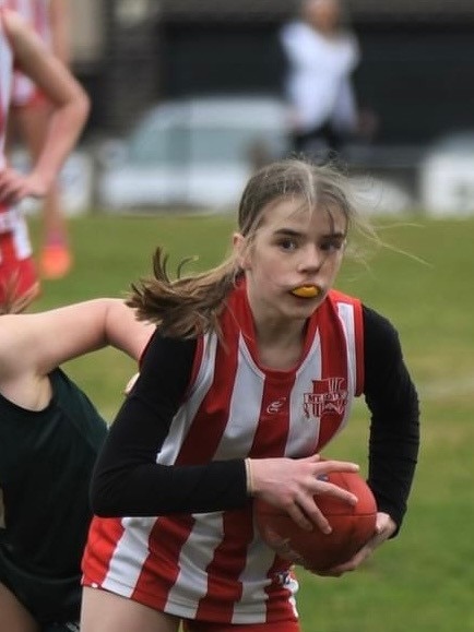 Lyla Neck playing football for Mt Lofty District Football Club . Picture: Supplied by Family