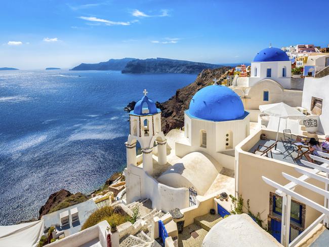 ESCAPE WEBSITE RELAUNCH HERO PIC .. Santorini blue dome churches, Greece. Picture: iStock