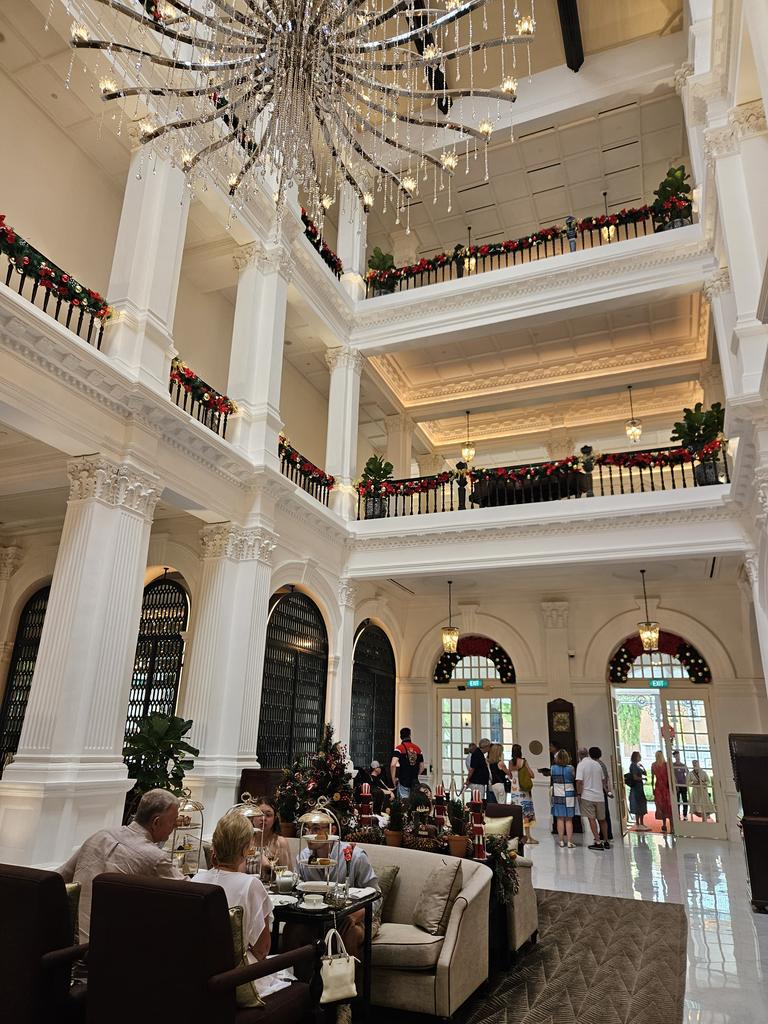 The beautiful main atrium at Raffles, where guests and visitors alike can have a high tea experience.