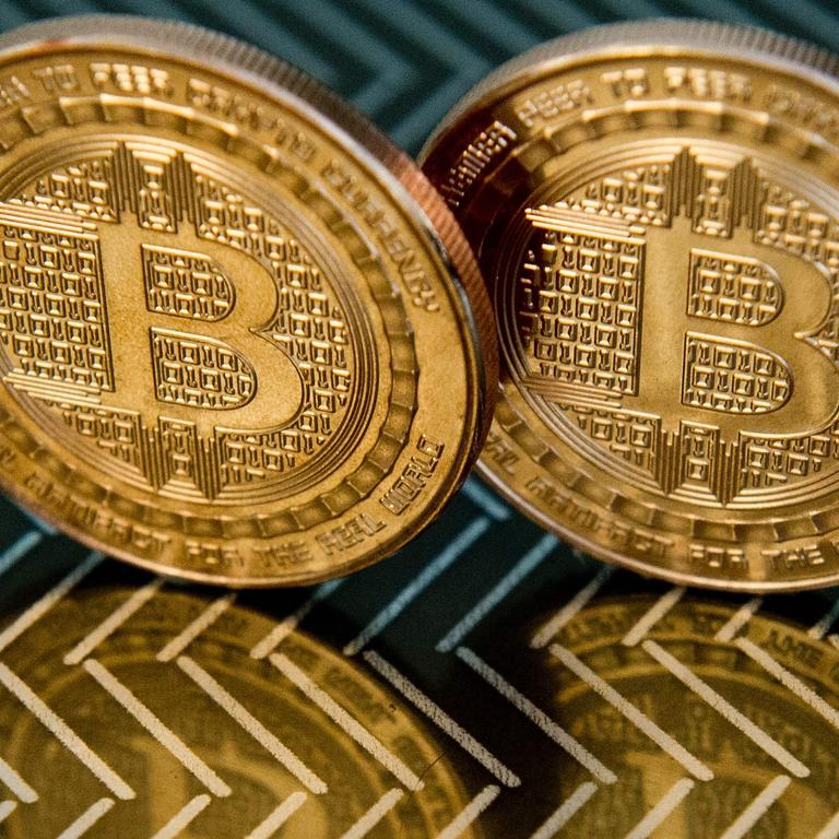 Cryptocurrencies like Bitcoin have made a lot of people rich, sometimes by making others poor. Picture: Karen Bleier / AFP)