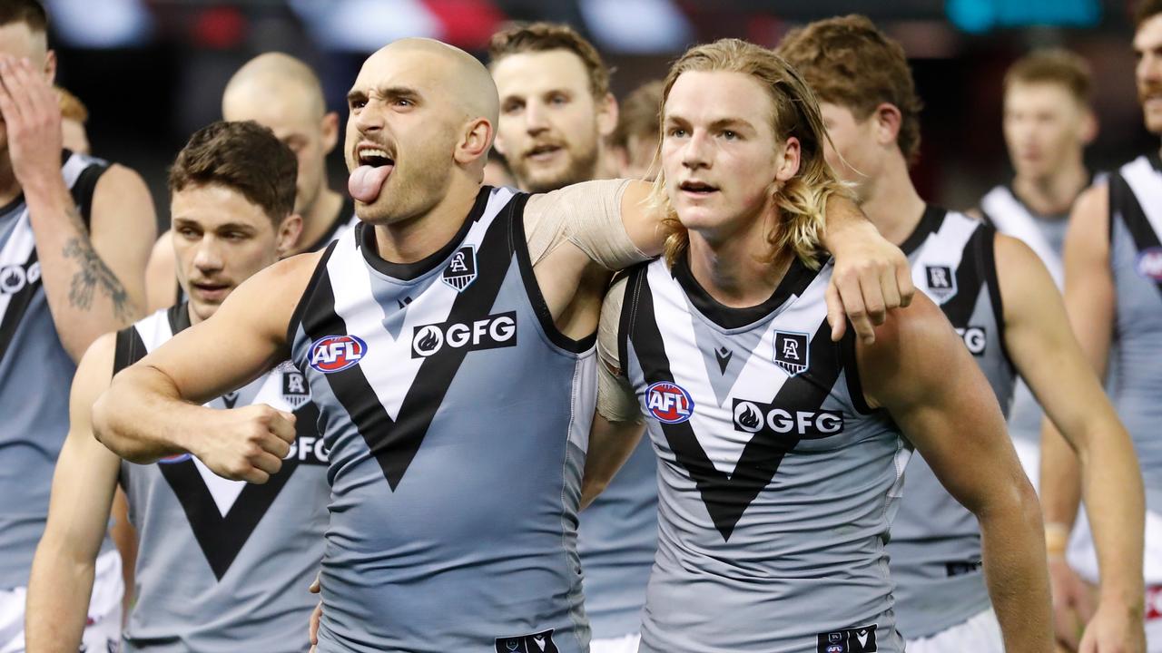 Sam Powell-Pepper and Miles Bergman enjoy Port Adelaide’s win.