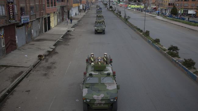 Military armoured vehicles patrol the streets of El Alto, Bolivia, on Friday after a quarantine from 5pm to 5am was decreed. Picture: AP