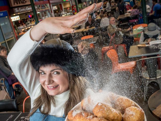 Preston Market. Jess Pelich sells the only Pirozhki in Melbourne. They are like a Russian donut and are all handmade from a family recipe, and are a traditional Eastern European snack - deep fried dough with savoury and sweet filling. Jess dusts a plate of apple and sour cherry piroshki with sugar at the Preston Market. Picture: Jake Nowakowski