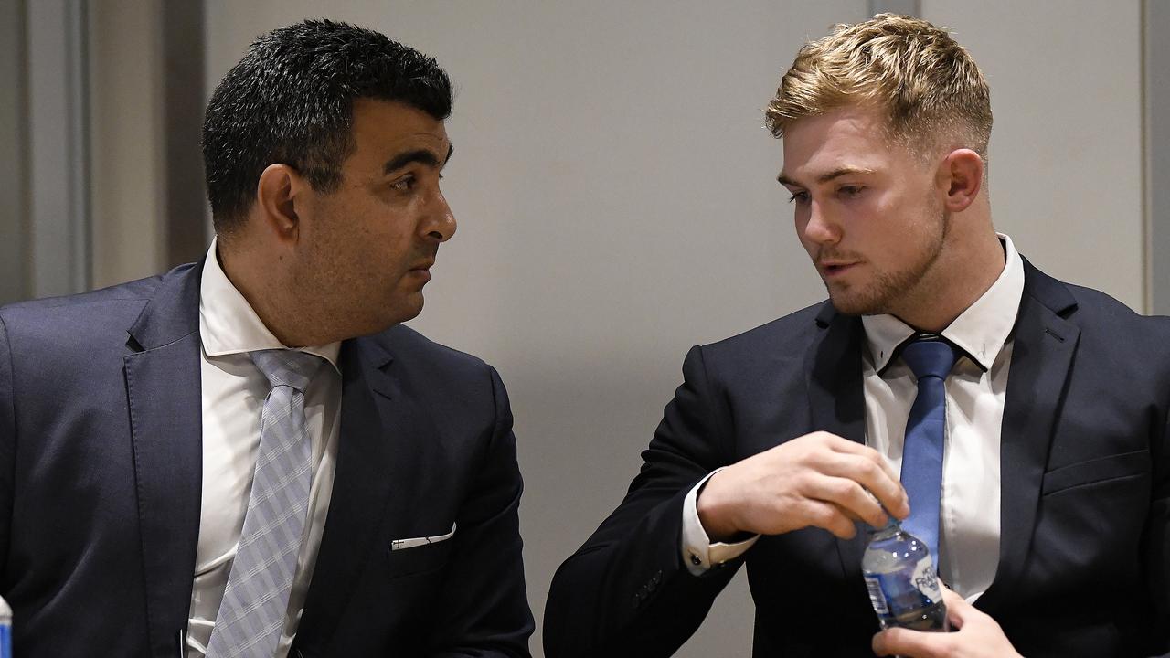 Canberra Raiders player Hudson Young (right) and his lawyer are seen at an NRL judiciary hearing on Tuesday.