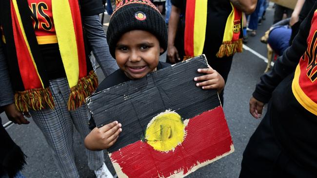 A young boy in Melbourne’s CBD during the protest. Picture: Jake Nowakowski