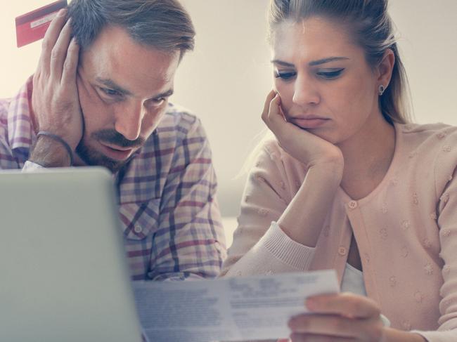 A couple having problem with bills and money. Generic relationships, laptop, expenses. Picture: iStock.