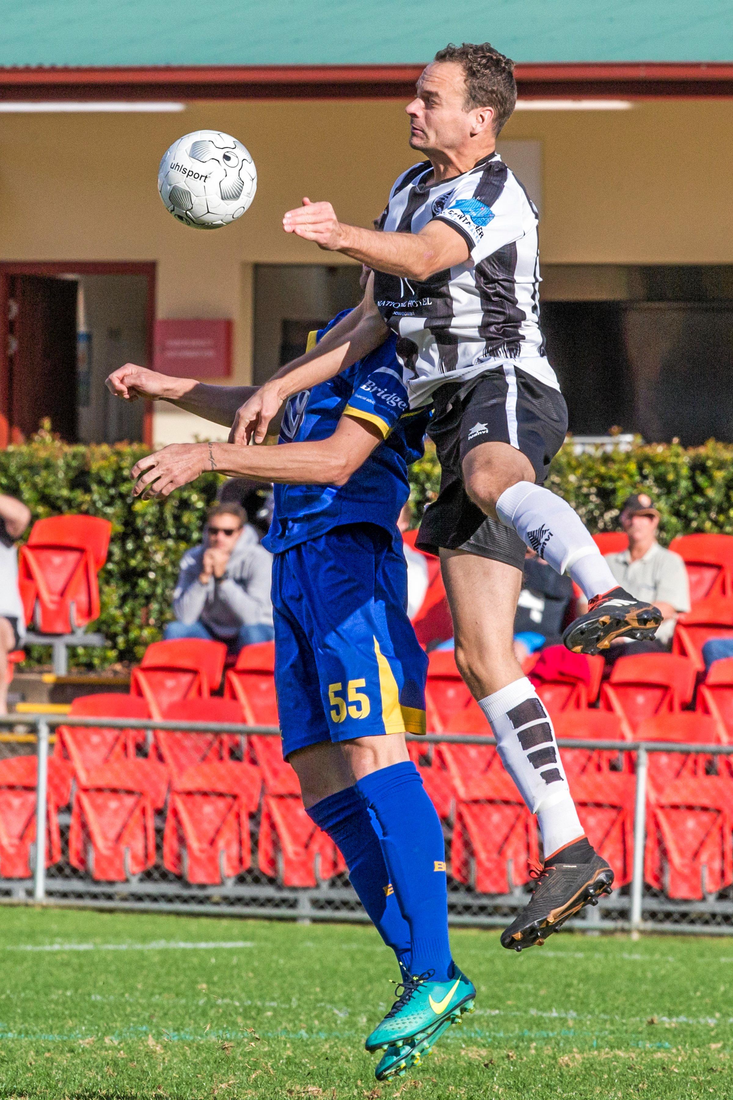 Willowburn's Pete Milican (right) heads over the top of Trent Bowles. Picture: Paul Smith