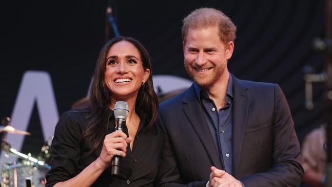 DUESSELDORF, GERMANY - SEPTEMBER 12: Prince Harry, Duke of Sussex and Meghan, Duchess of Sussex speak on stage at the "Friends @ Home Event" at the Station Airport during day three of the Invictus Games DÃÂ¼sseldorf 2023 on September 12, 2023 in Duesseldorf, Germany. (Photo by Chris Jackson/Getty Images for the Invictus Games Foundation)