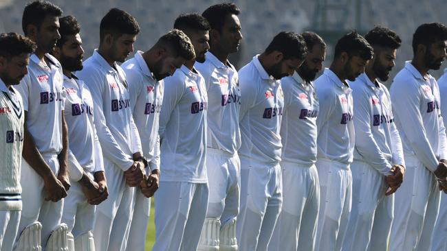 The Indian cricket team also observed a minute of silence before Day 2 of its Test against Sri Lanka. (Photo by PRAKASH SINGH / AFP)