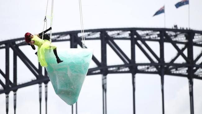 Performer Victoria Hunt atop the Thaw sculpture for the Sydney Festival. Picture: Don Arnold