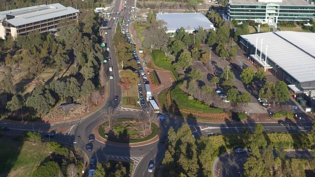 Traffic at the roundabout intersection of Lexington Drive and Norwest Blvd, Bella Vista. Cinemair Aerial Photography (cinemairap.com.au)