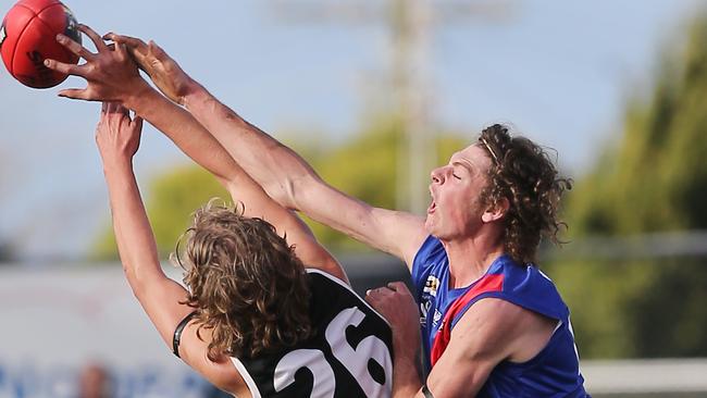 Terang Mortlake’s Rhys Buck tries to block the ball against Koroit. Picture Yuri Kouzmin