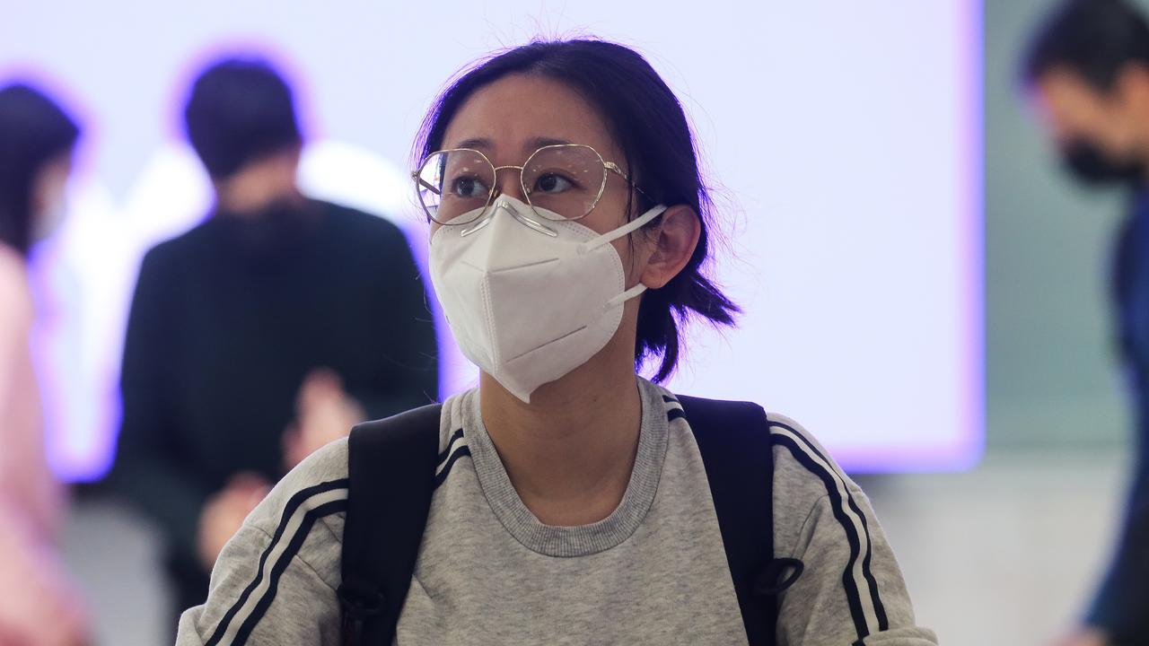 People are seen arriving at Sydney International Airport from Hong Kong after Australia set new Covid entry rules for travellers entering the country from China. Picture: NCA Newswire / Gaye Gerard