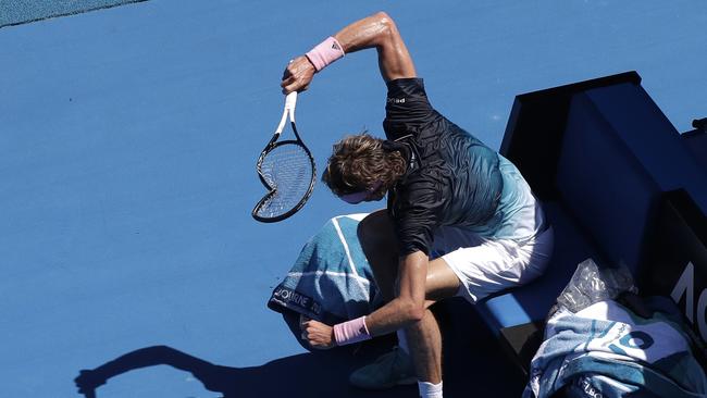 Germany's Alexander Zverev smashes his racket in frustration during his fourth round match against Canada's Milos Raonic at the Australian Open tennis championships in Melbourne, Australia, Monday, Jan. 21, 2019. (AP Photo/Kin Cheung)