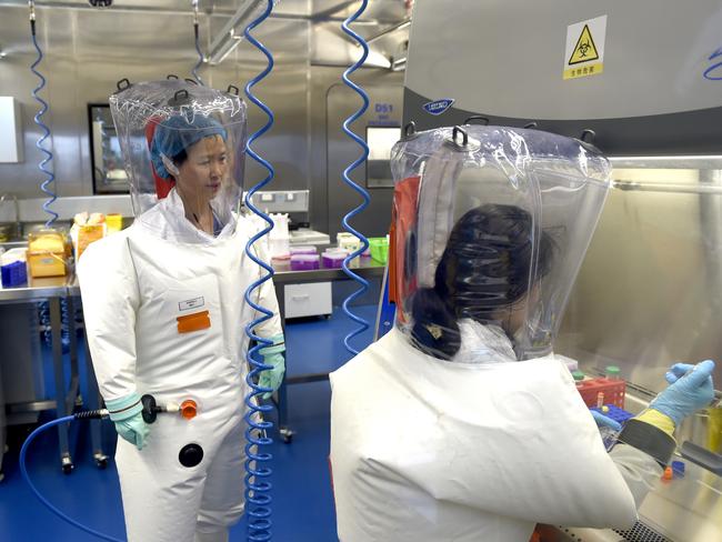 WUHAN, CHINA - FEBRUARY 23 2017: Virologist Shi Zheng-li, left, works with her colleague in the P4 lab of Wuhan Institute of Virology (WIV) in Wuhan in central China's Hubei province Thursday, Feb. 23, 2017.- PHOTOGRAPH BY Feature China / Barcroft Studios / Future Publishing (Photo credit should read Feature China/Barcroft Media via Getty Images)