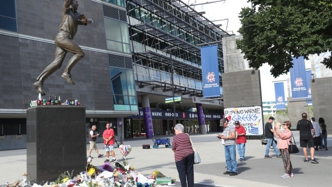 A growing floral tribute at the Shane Warne stadium outside the Melbourne Cricket Ground. Picture: NCA NewsWire / David Crosling