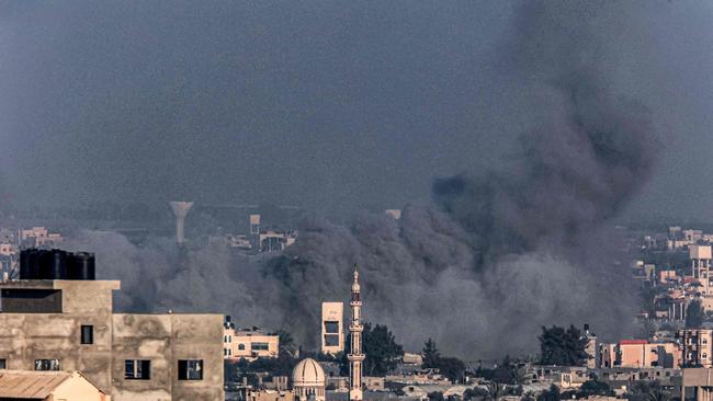 Smoke billows over Khan Yunis during Israeli bombardment from Rafah in the southern Gaza Strip on December 25, 2023. Picture: AFP