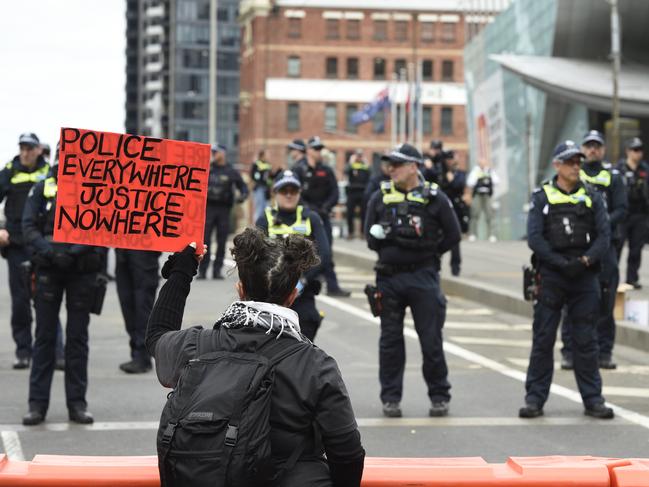 Protesters gather on Spencer Street Bridge. Picture: Andrew Henshaw