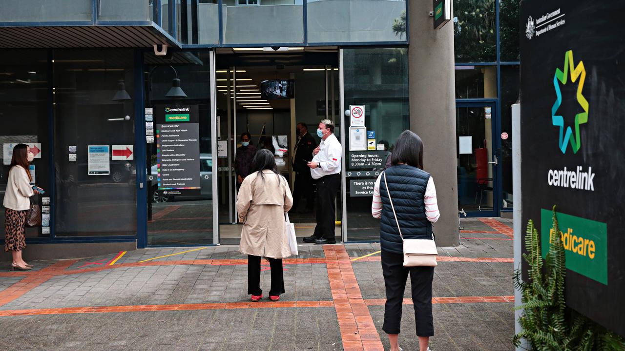 People waiting out the front of Centrelink in Burwood. Picture: NCA NewsWire / Adam Yip