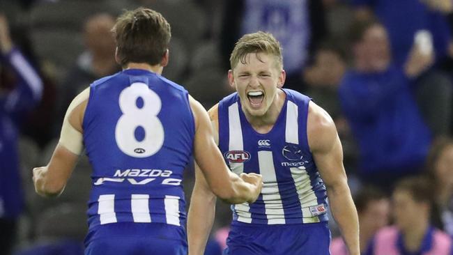 Jack Ziebell celebrates with Nathan Hrovat after North Melbourne’s first win. Picture: Getty Images