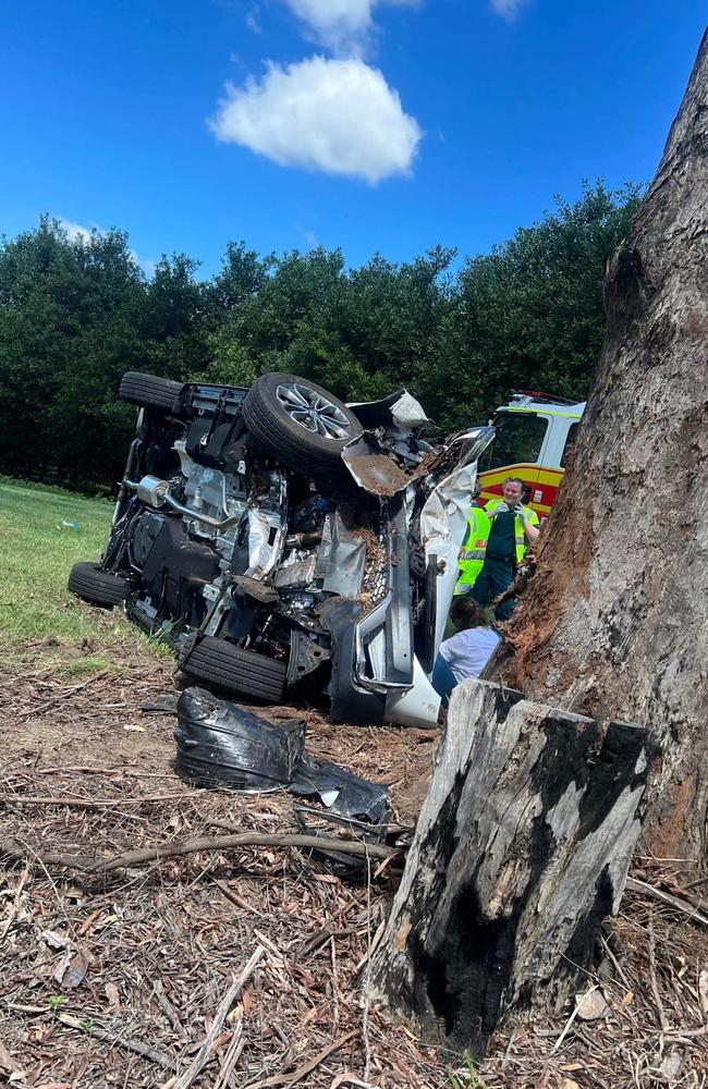 A man in his 50s has been rushed to hospital after his car rolled and hit a tree in the Glass House Mountains.