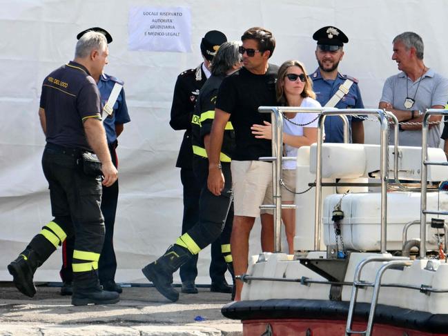 Loved ones hug each other on the pier of Porticello near Palermo, during the search. Picture: AFP