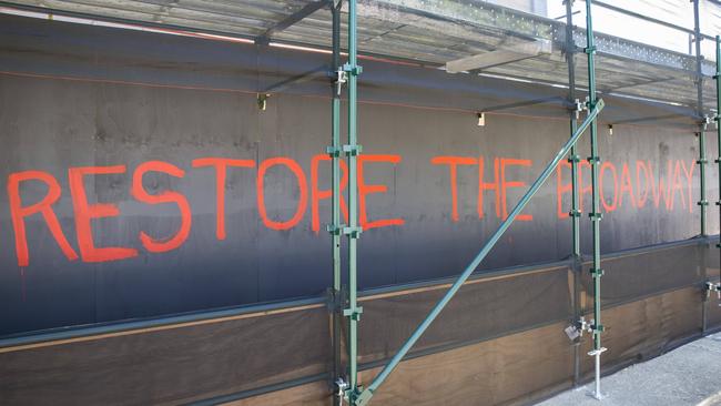 Graffiti on hoardings around the site. Picture: AAP/Richard Walker