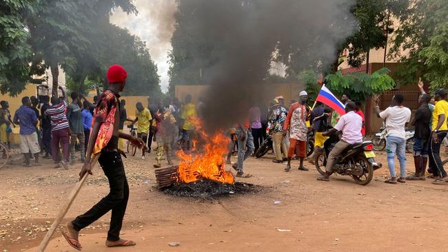 Protesters gather outside the French Embassy in Ouagadougou on Sunday following the military coup. Picture: AFP