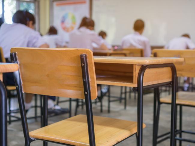 Lecture room or School empty classroom with Student taking exams, writing examination for studying lessons in high school thailand, interior of secondary education, whiteboard. educational concept