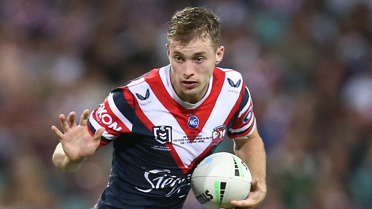 Sam Walker of the Roosters runs the ball during his debut.