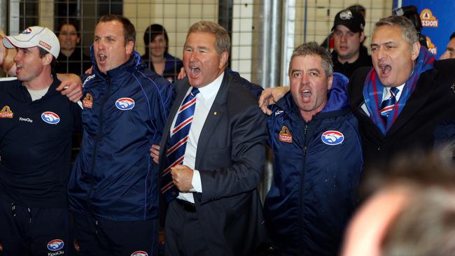 President David Smorgon leads a rousing rendition of the song after the turmoil of the Akermanis sacking in the week leading up to the Round 17 game.