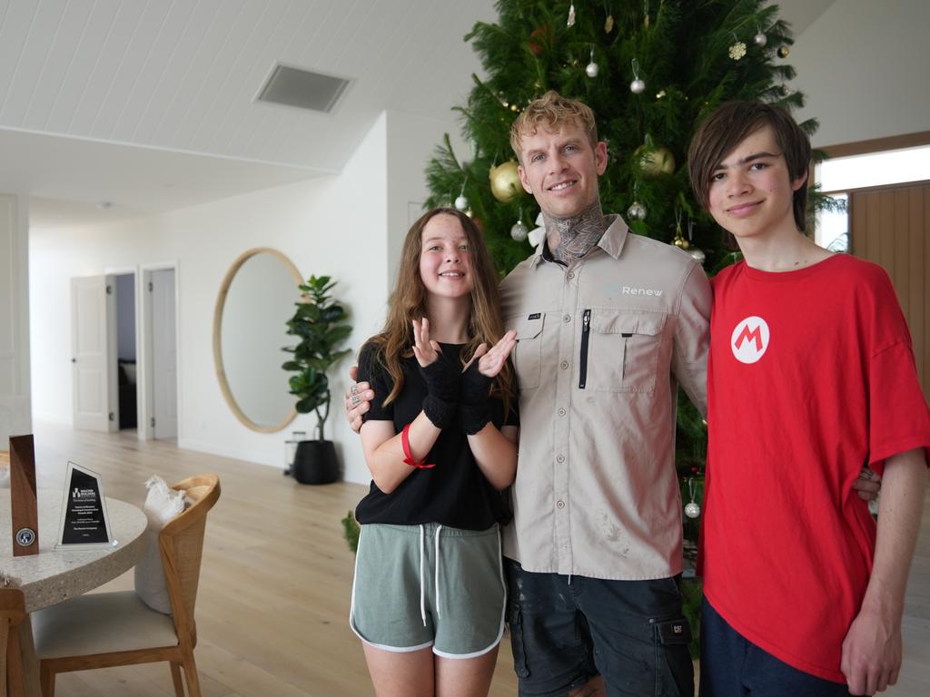 Toowoomba builder Colin Wilson's house Callista in Gowrie Junction has taken out the Master Builders' National Excellence in Building and Construction Award for best home in the $500,000 to $750,000 category. He's pictured with children Achilles and Harper.