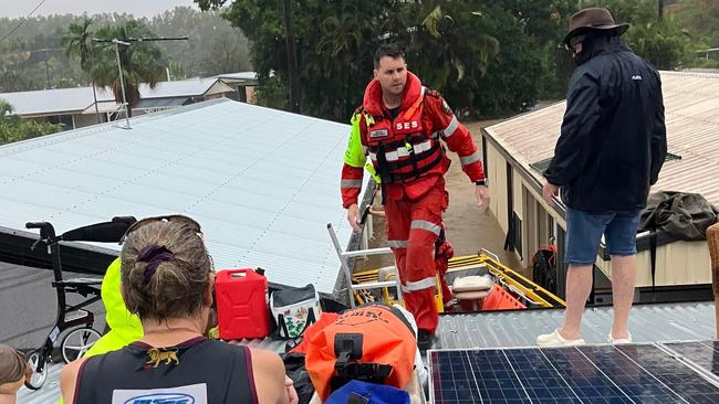 Holloways Beach residents are being rescued by SES volunteers.