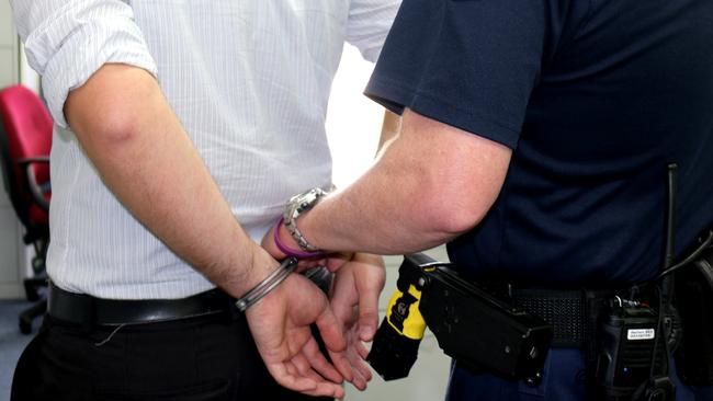 A man being handcuffed by police. Generic queensland police. Photo Amy Lyne / Gatton Star