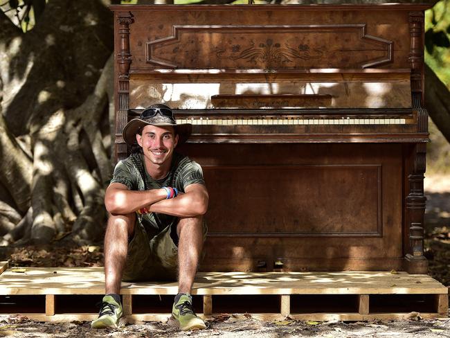 Hayden Clarke used his ute to transport a piano to Radical Bay on Magnetic Island, after a piano at the site was previously burnt down. PICTURE: MATT TAYLOR.