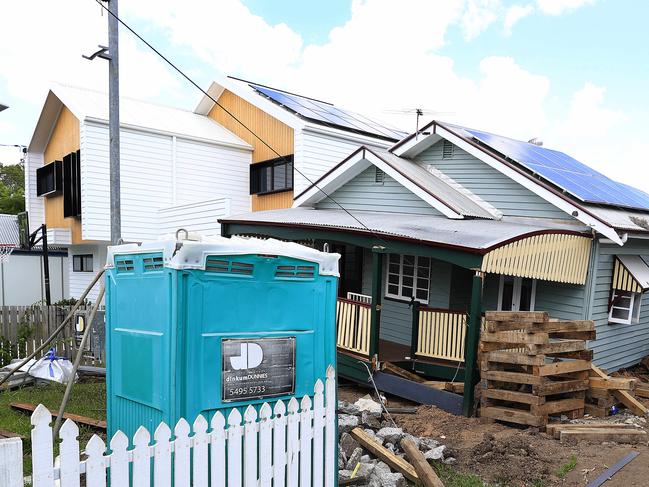 A house has fallen off its pillars on Borden Street, Sherwood and come to rest on the house next door. Pics Adam Head