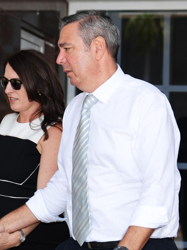 Former Elders real estate agent Chris Deutrom leaves the NT Supreme Court with his wife, Helen, on the first day of his fraud trial