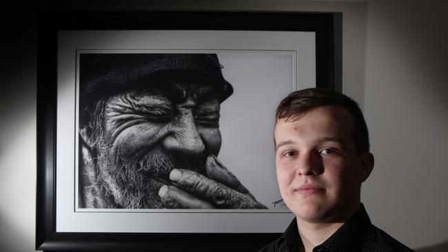 Penrith Anglican College Year 12 student Travis Goodshaw, 18, with his artwork. Picture: Robert Pozo