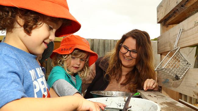 Megan Siemek, pictured with Alby, left, and Hudson in the mud kitchen, said the outstanding rating validated the team’s hard work. Picture: Alison Wynd