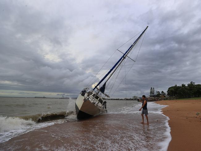 Townsville locals including Dr Deepak Doshi woke early to inspect the damage along The Strand left from TC Kirrily that hit overnight. Pics Adam Head