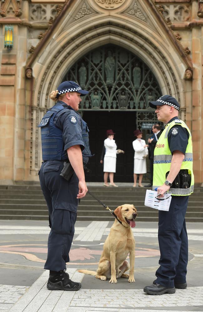 Police arrive at the cathedral with a canine. Picture: Jay Town