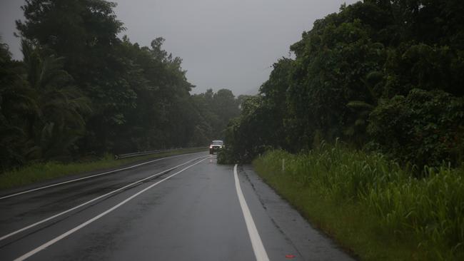 The Bruce Highway during a storm where a fallen tree blocked traffic. Picture: Arun Singh Mann