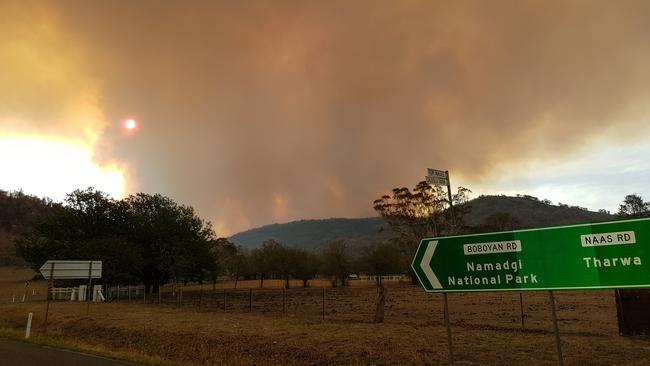 Smoke rising from the Namadgi National Park fire burning south of Canberra. Residents of the small rural village of Tharwa have been told that it's too late to leave. Picture: AAP Image/Ralph Hurst-Meyers.