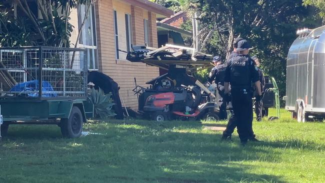 Police search the property. Picture: Charlton Hart