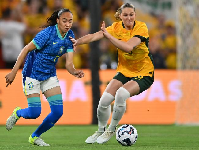 BRISBANE, AUSTRALIA – NOVEMBER 28: Aline Gomes Amaro of Brazil and Winonah Heatley of Australia compete for the ball during the International Friendly match between the Matildas and Brazil at Suncorp Stadium on November 28, 2024 in Brisbane, Australia. (Photo by Albert Perez/Getty Images)