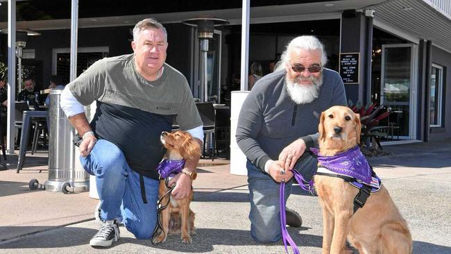 Andrew Harris and Roger Weeks at Riba Kai with rescued dogs that they train to assist those affected by PTSD. Picture: John McCutcheon