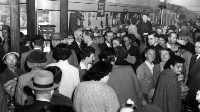 Customers on closing day of Foy &amp; Gibson in June 1956. The store was popular with shoppers during the Christmas rush in the 1940s and 50s. A giant Santa used to sit out the front of the store, which also had a beloved rooftop Christmas fun park, which featured rides, ponies and a petting zoo.