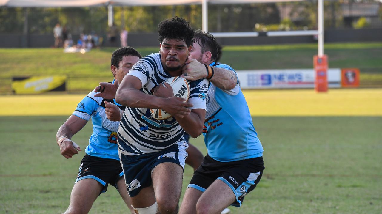 Elijah Coombes charges through David Munro and Brent Crisp to score a try for Darwin Brothers. Picture: Pema Tamang Pakhrin