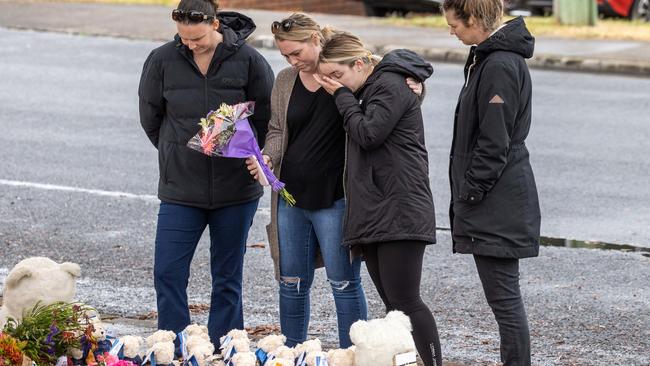 Emotional emergency workers pay tribute to the children. Picture: Jason Edwards